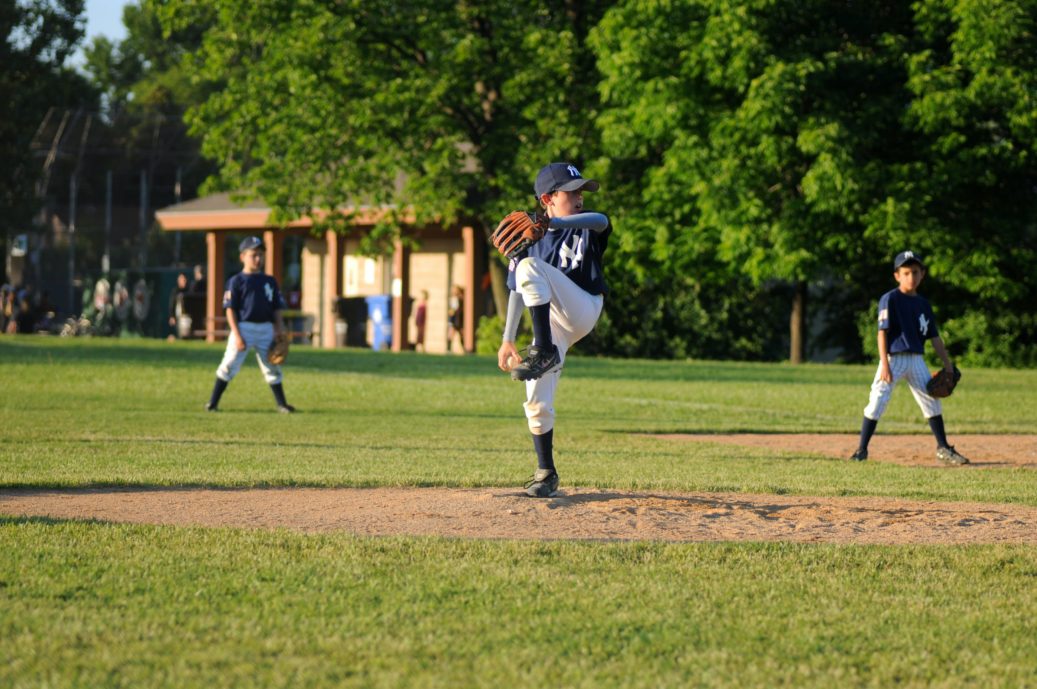 boys playing baseball pitcher