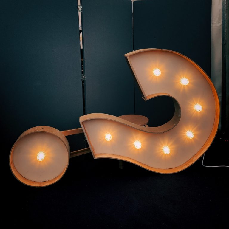 lit up question mark on side