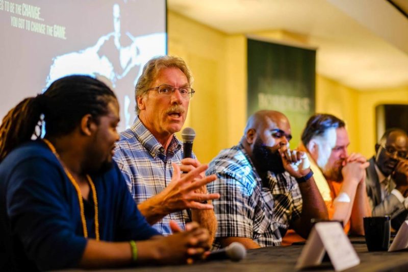 panel with man speaking into mic