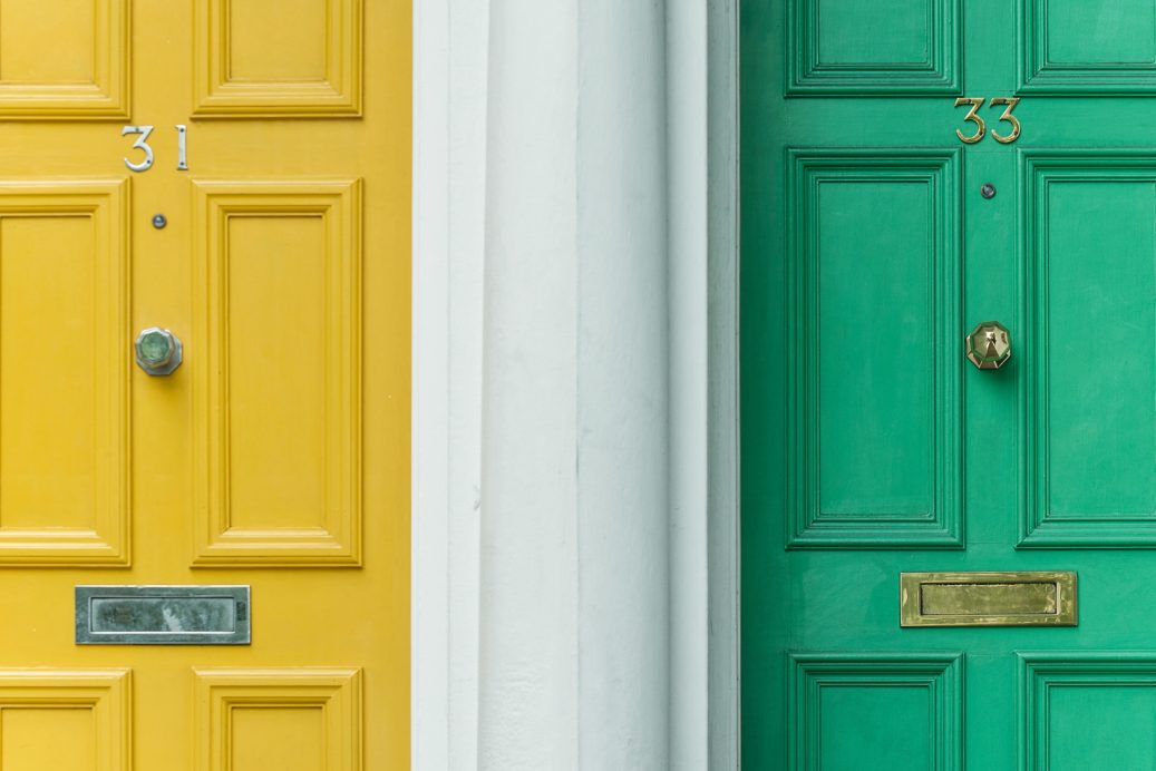 next door neighbor doors yellow and green