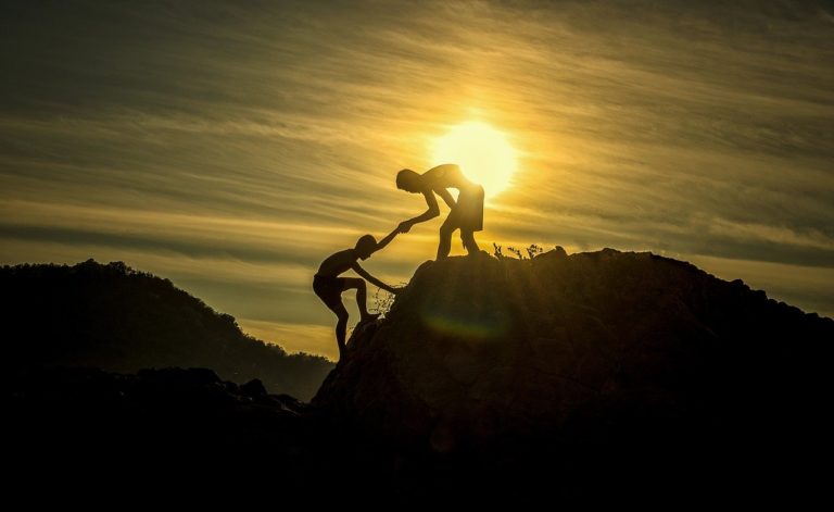 men climbing mountain
