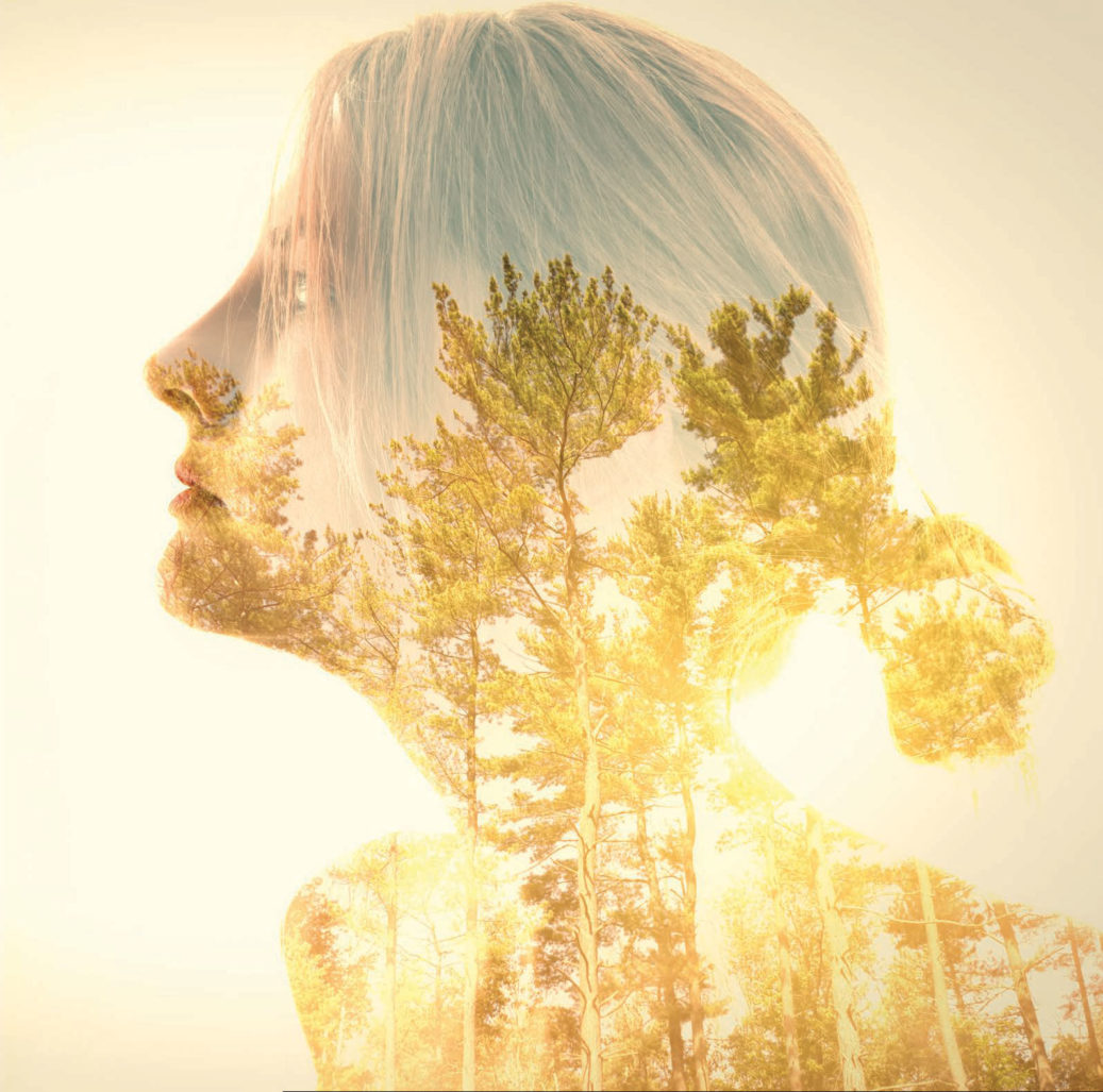 tree in woman's face glowing