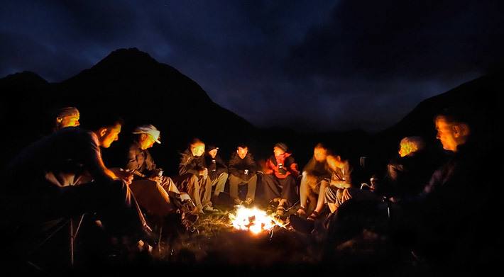 telling stories around a campfire