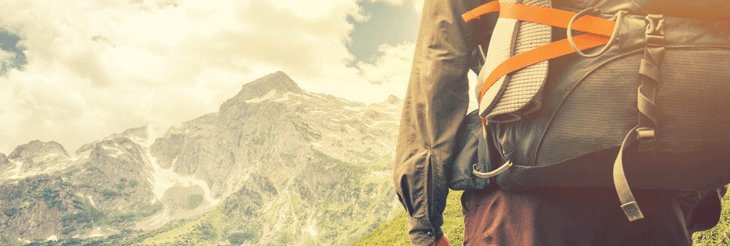 man with backpack hiking