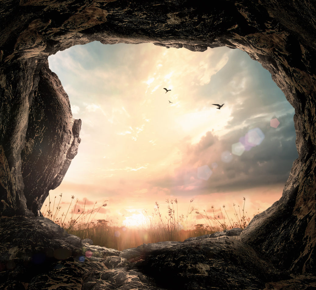 Good Friday concept - Open empty tomb stone at autumn sunrise background