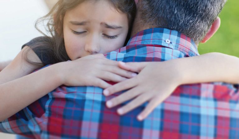 daughter hugging dad