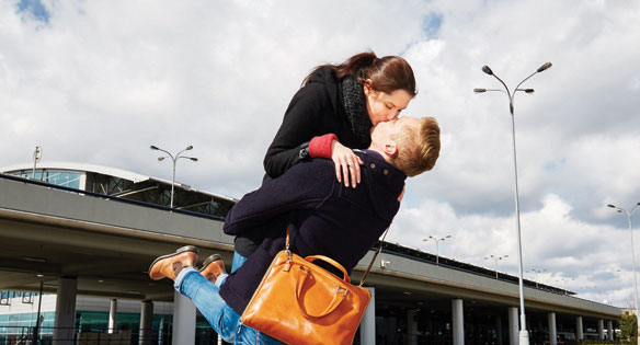 man and woman reunited at the airport