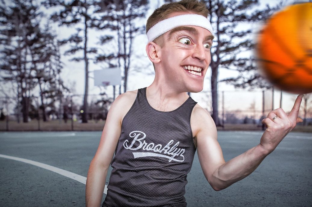 guy with big eyes spinning a basketball