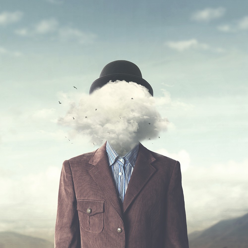 man with head in cloud