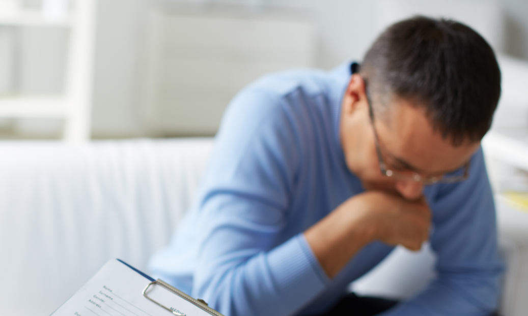 man on couch of counselors office