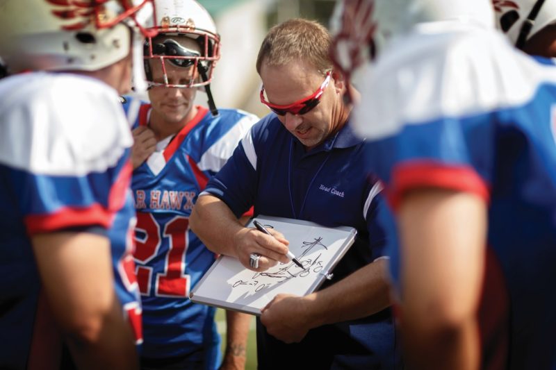 coach showing team play board