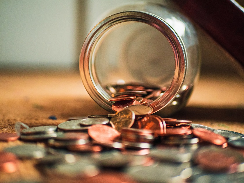 jar of coins spilling out