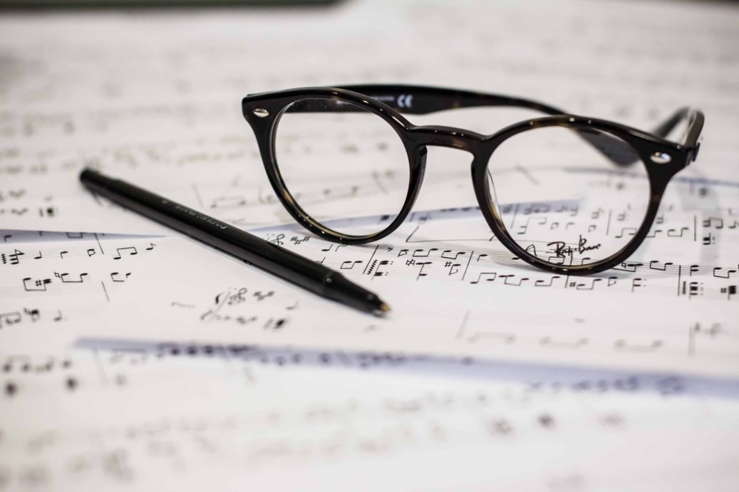 Sheet music, glasses, pen