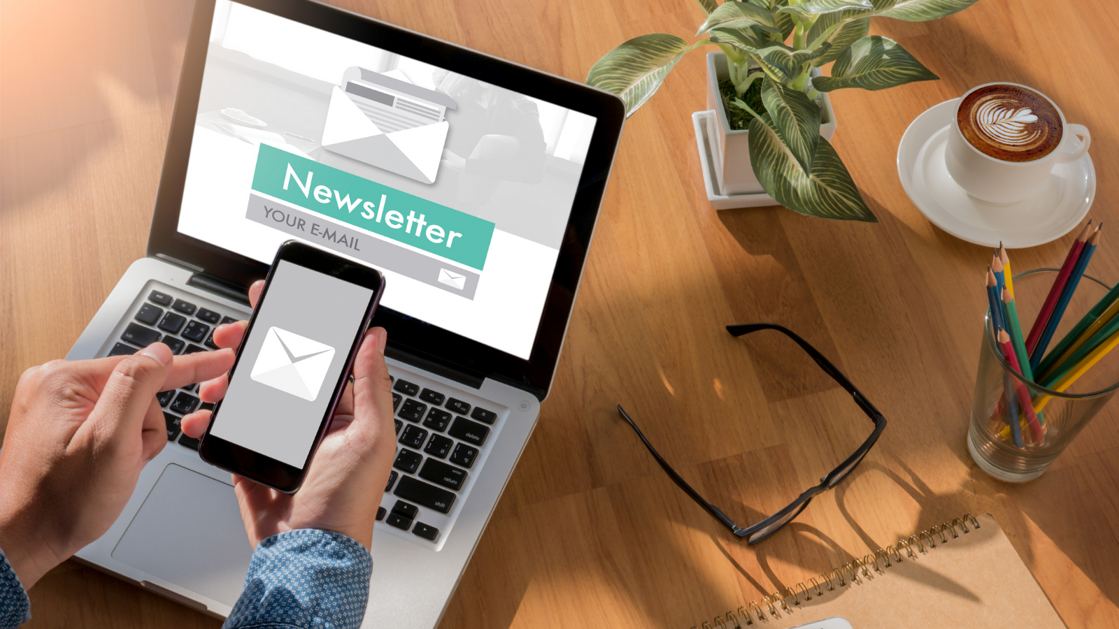 newsletter signup with mobile and laptop