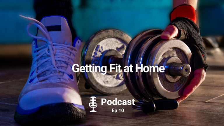 Man assembling a metal dumbbell during home workout in a dark living room